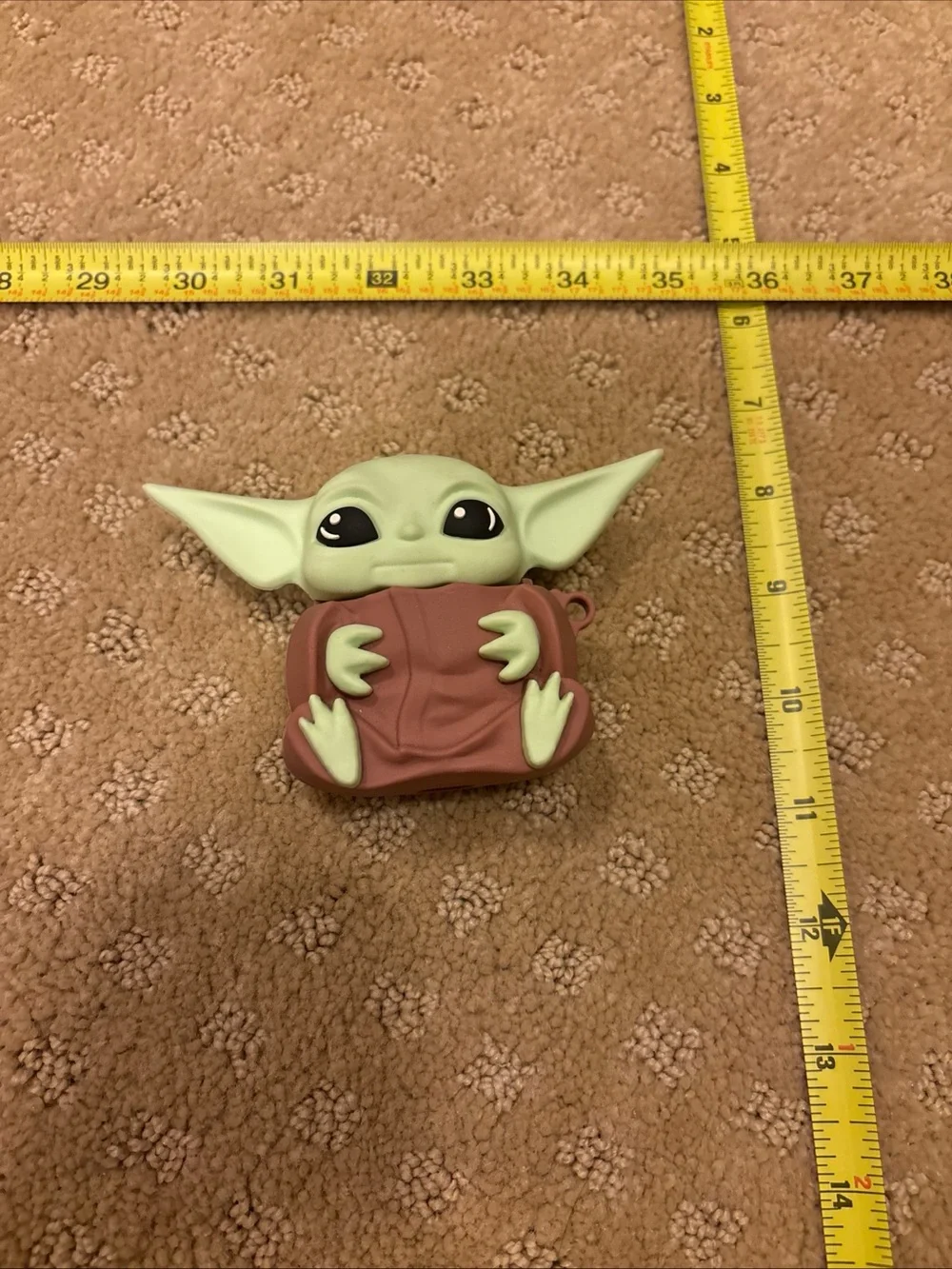 Green Baby Yoda Figurine Ear bud holder  with Brown Cloak